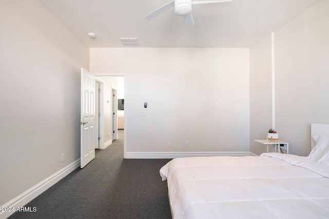 unfurnished bedroom featuring ceiling fan and dark colored carpet