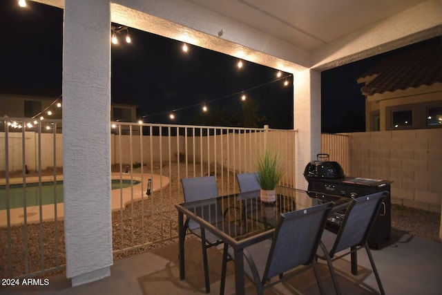 patio at twilight with a swimming pool