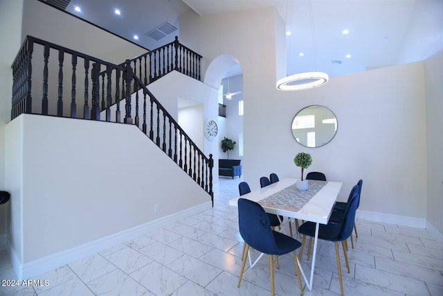 dining area with a high ceiling