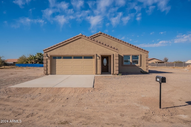 view of front of property with a garage