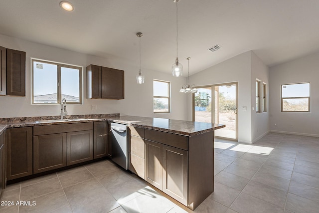 kitchen with sink, vaulted ceiling, light tile patterned floors, kitchen peninsula, and a chandelier