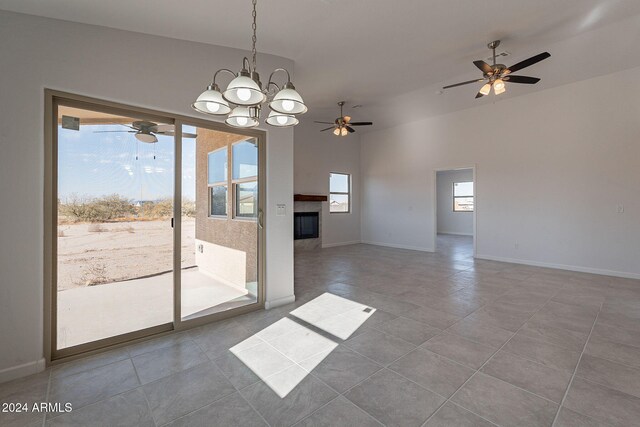 interior space with tile patterned floors and a notable chandelier