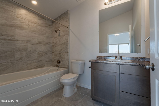 full bathroom with tile patterned floors, toilet, vanity, and tiled shower / bath