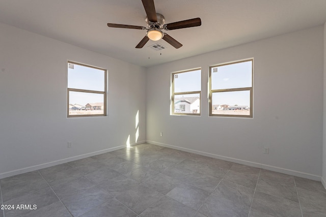 spare room with ceiling fan