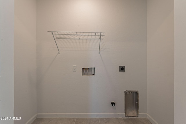 laundry area with light tile patterned floors, washer hookup, and hookup for an electric dryer