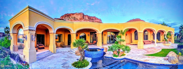 back of house featuring a patio area