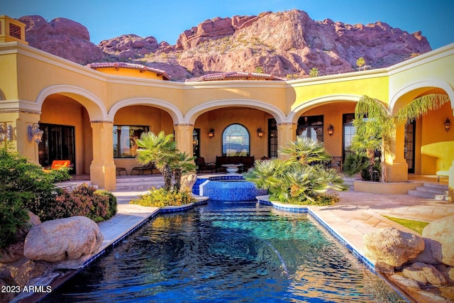 view of swimming pool featuring a mountain view