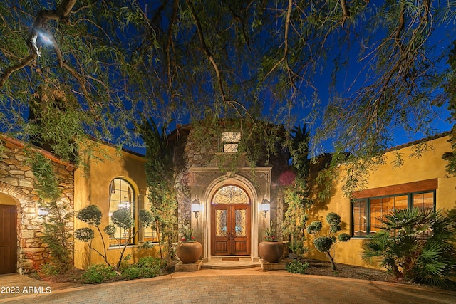 exterior entry at twilight with french doors