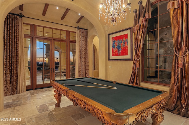 game room featuring a chandelier, billiards, and french doors