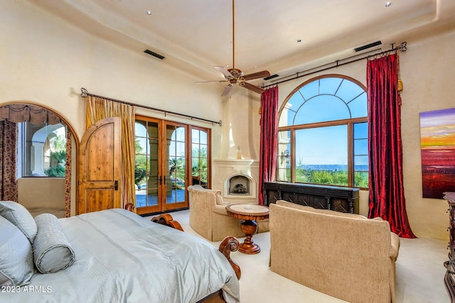 bedroom featuring ceiling fan, french doors, access to outside, and multiple windows