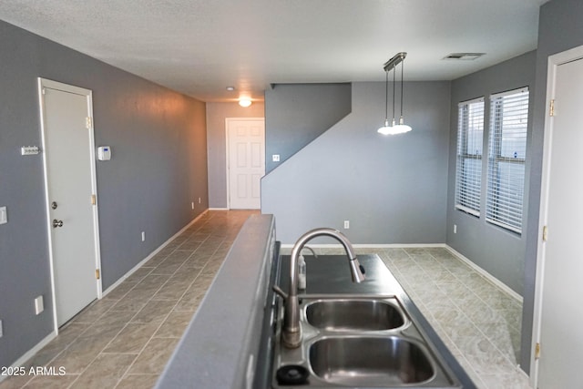 kitchen with hanging light fixtures and sink