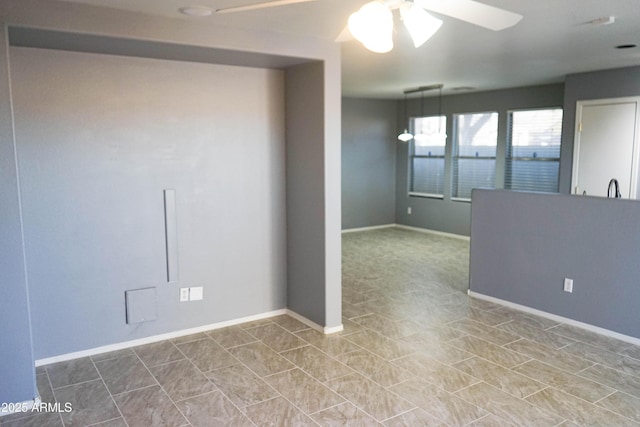 spare room featuring ceiling fan