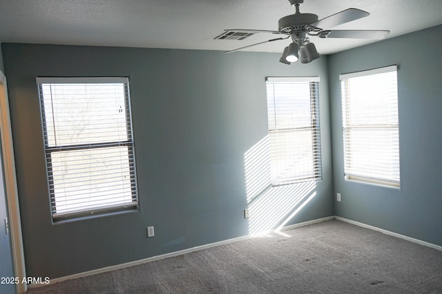 unfurnished room with carpet and ceiling fan