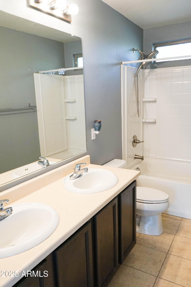 full bathroom featuring tile patterned floors, vanity, bathtub / shower combination, and toilet