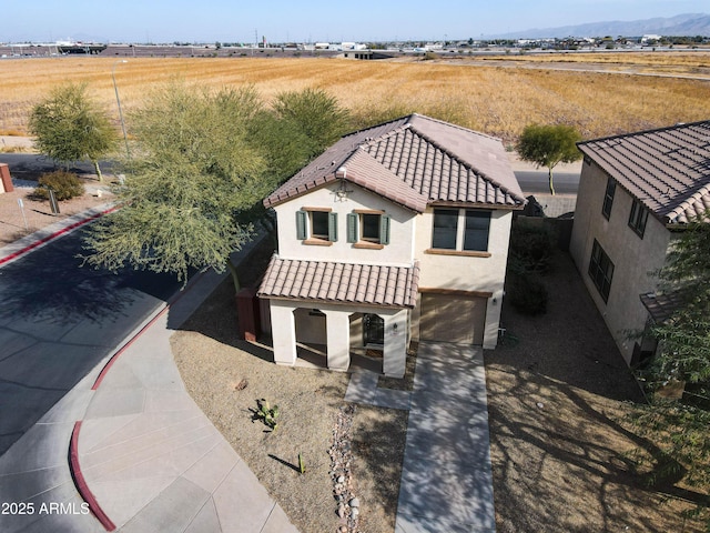 drone / aerial view featuring a mountain view and a rural view