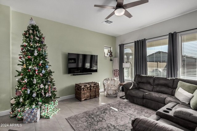 tiled living room featuring ceiling fan