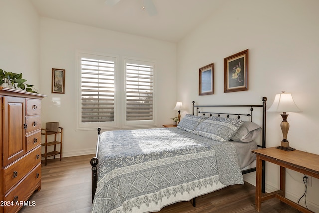 bedroom with ceiling fan and dark hardwood / wood-style flooring