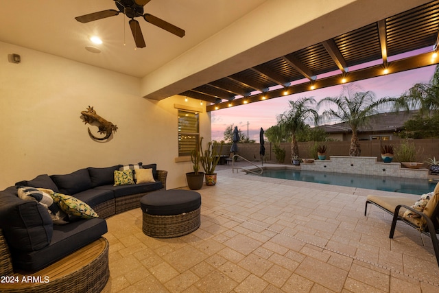 patio terrace at dusk with outdoor lounge area, ceiling fan, and a fenced in pool