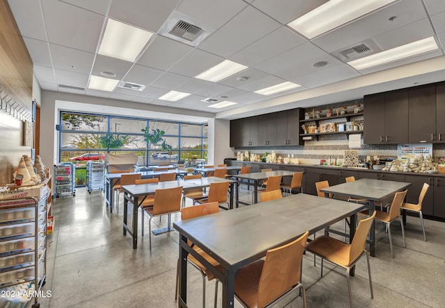 dining area with a drop ceiling