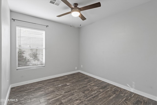 unfurnished room with ceiling fan and dark hardwood / wood-style flooring