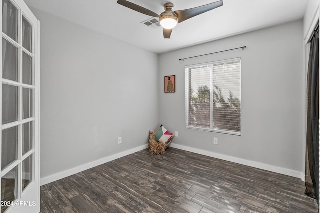 unfurnished room featuring ceiling fan and dark hardwood / wood-style floors