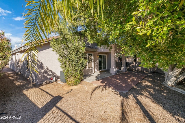 back of house featuring a patio area