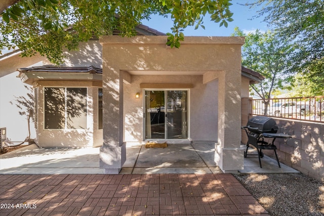 rear view of property featuring a patio