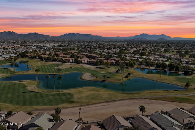 aerial view at dusk with a water and mountain view