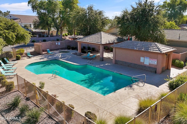 view of swimming pool with a gazebo and a patio