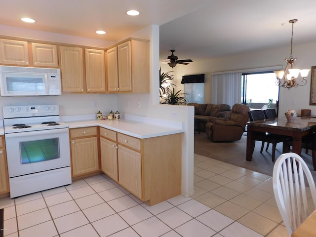 kitchen with light brown cabinetry, open floor plan, light countertops, light tile patterned floors, and white appliances