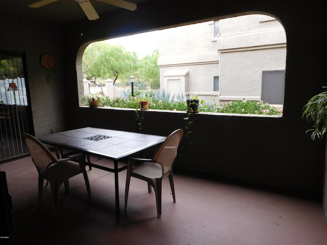 view of patio / terrace with outdoor dining area and a ceiling fan