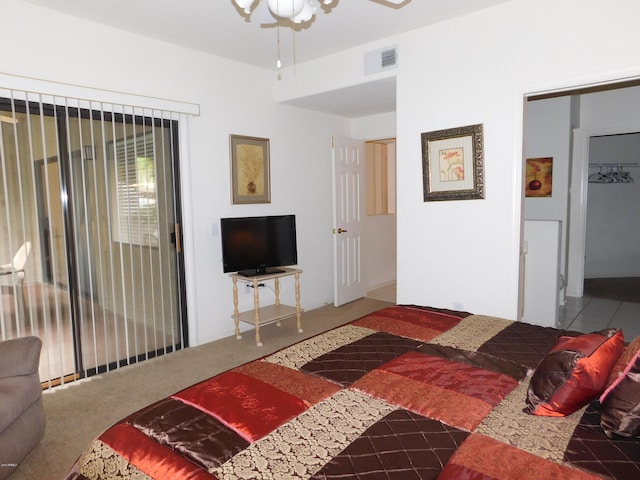 bedroom featuring visible vents, carpet flooring, and access to outside