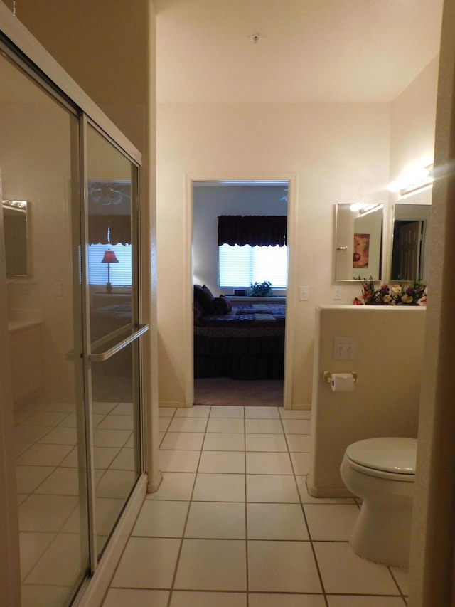 bathroom featuring ensuite bath, toilet, a stall shower, and tile patterned floors