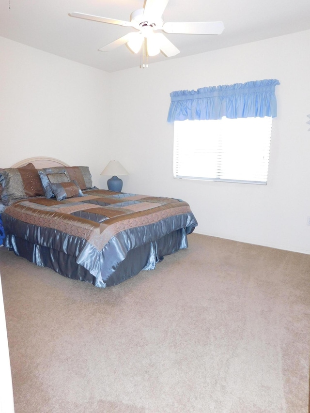 bedroom with carpet and ceiling fan