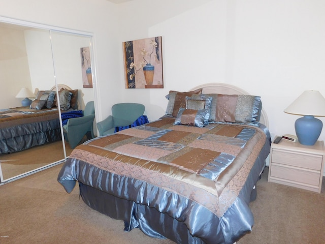 carpeted bedroom with a closet