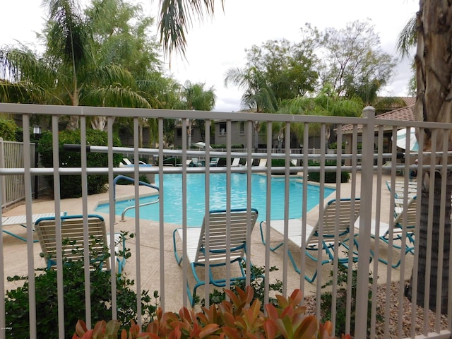 community pool featuring fence