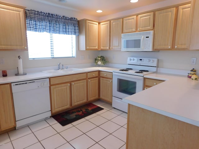 kitchen featuring a sink, white appliances, light tile patterned floors, and light brown cabinetry