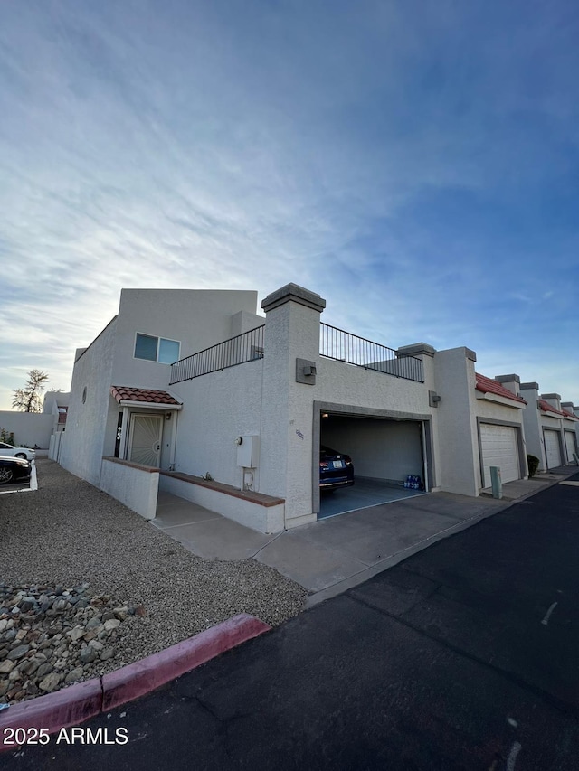 9060 N 47th Ln, Glendale, AZ 85302 - view of home's exterior with stucco siding and asphalt driveway