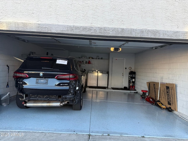 9060 N 47th Ln, Glendale, AZ 85302 - garage with washer and clothes dryer and a garage door opener
