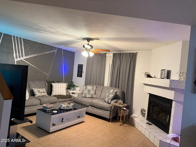 9060 N 47th Ln, Glendale, AZ 85302 - living area with tile patterned flooring, a tile fireplace, and a ceiling fan