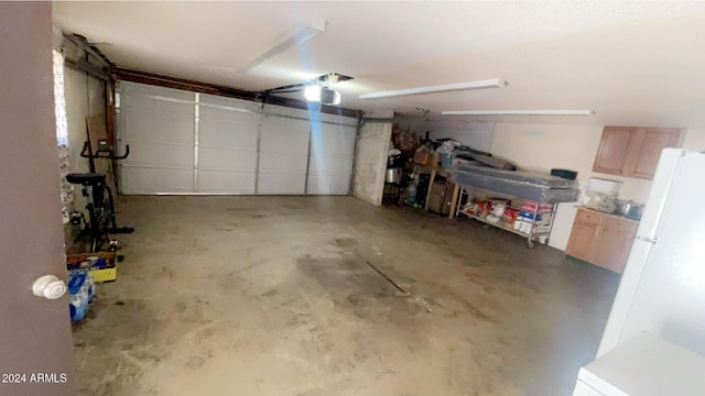 garage featuring white fridge