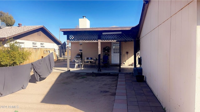 rear view of property featuring a patio