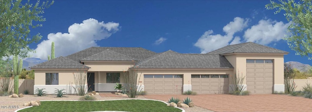 1906 E Cloud Rd, Phoenix, AZ 85086 - view of front of home featuring stucco siding, a garage, and driveway