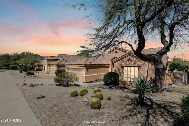 16914 E Britt Ct, Fountain Hills, AZ 85268 - view of front of home featuring fence, stucco siding, a tile roof, and an attached garage