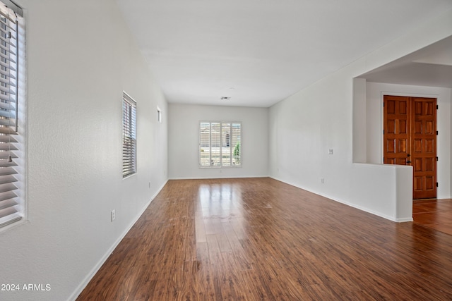 16914 E Britt Ct, Fountain Hills, AZ 85268 - unfurnished living room featuring baseboards and wood finished floors