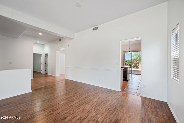 16914 E Britt Ct, Fountain Hills, AZ 85268 - empty room featuring recessed lighting, arched walkways, wood finished floors, baseboards, and visible vents