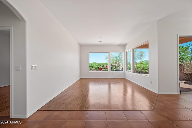 16914 E Britt Ct, Fountain Hills, AZ 85268 - spare room featuring tile patterned floors, plenty of natural light, baseboards, and arched walkways