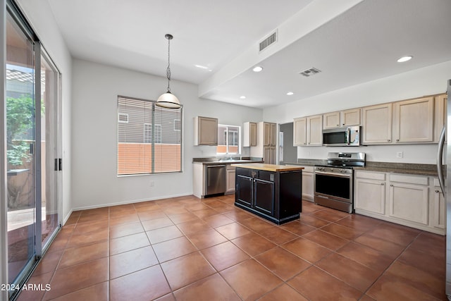 16914 E Britt Ct, Fountain Hills, AZ 85268 - kitchen featuring appliances with stainless steel finishes, visible vents, a kitchen island, recessed lighting, and dark tile patterned floors