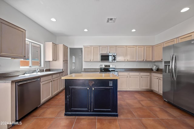 16914 E Britt Ct, Fountain Hills, AZ 85268 - kitchen with visible vents, stainless steel appliances, a center island, recessed lighting, and dark tile patterned floors