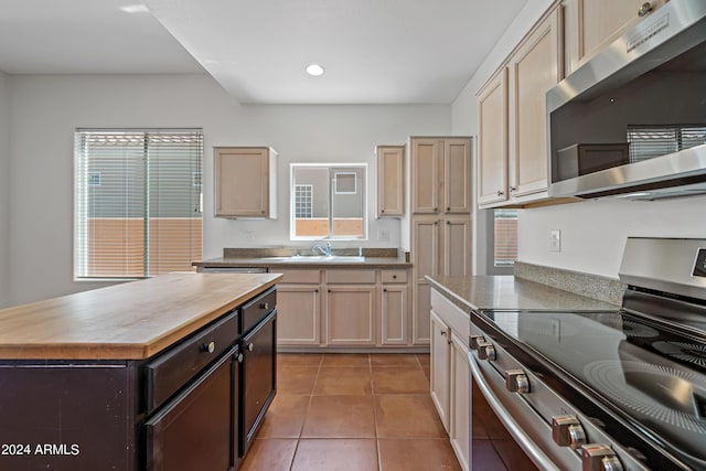 16914 E Britt Ct, Fountain Hills, AZ 85268 - kitchen with recessed lighting, light tile patterned floors, appliances with stainless steel finishes, dark brown cabinets, and a sink